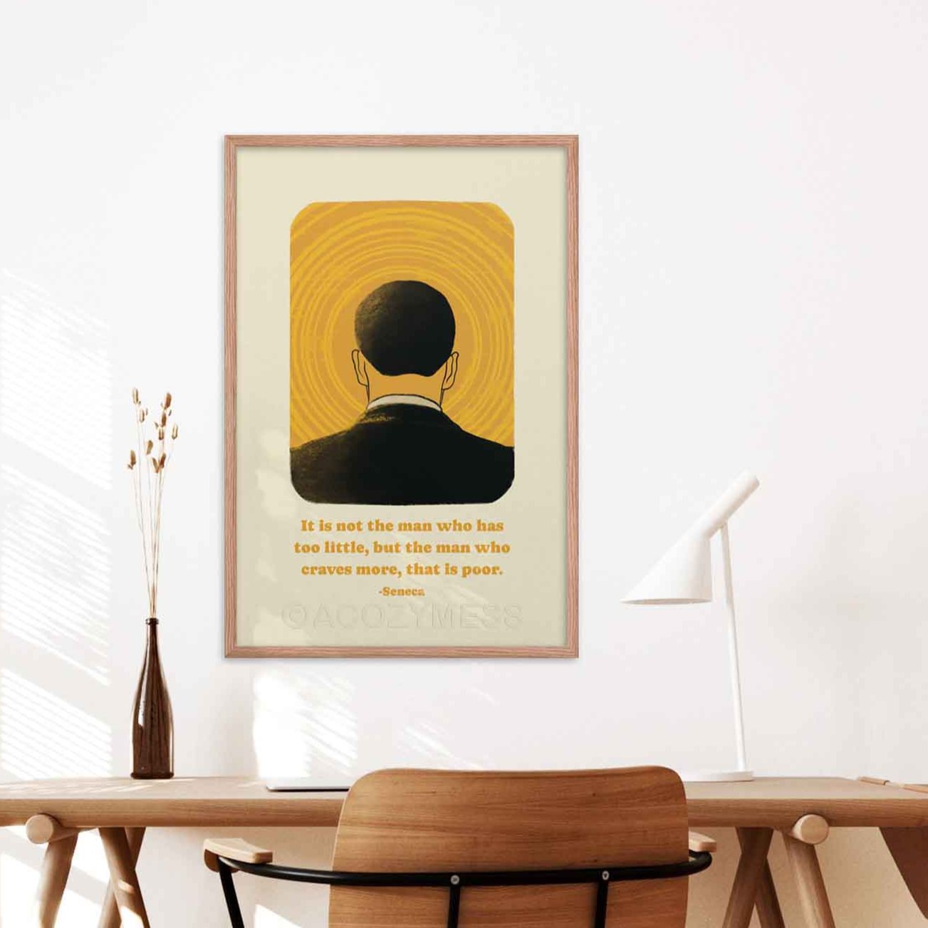 Seneca poster with quote on greed with yellow and black illustrationon light beige, framed in black inspirational and philosophical decor for study