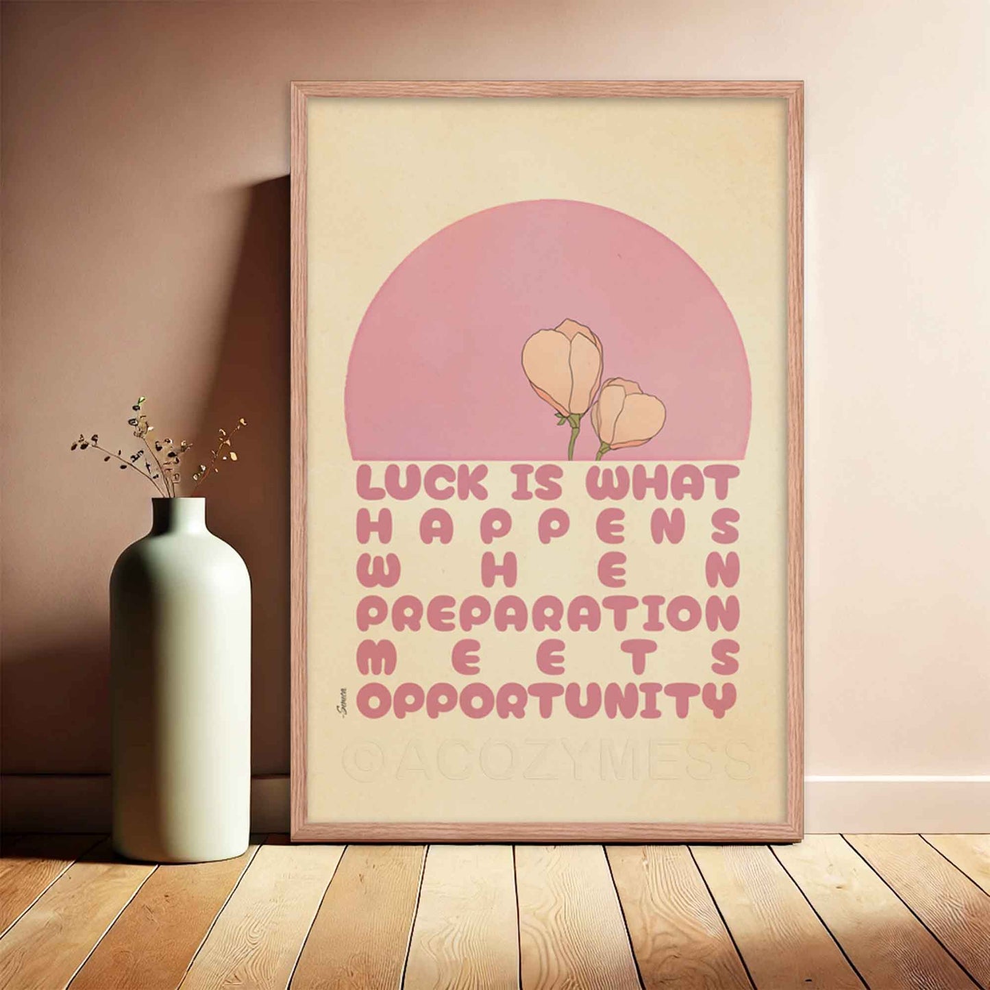 Seneca quote on luck poster with cute floral design in pink and beige in oakwood frame