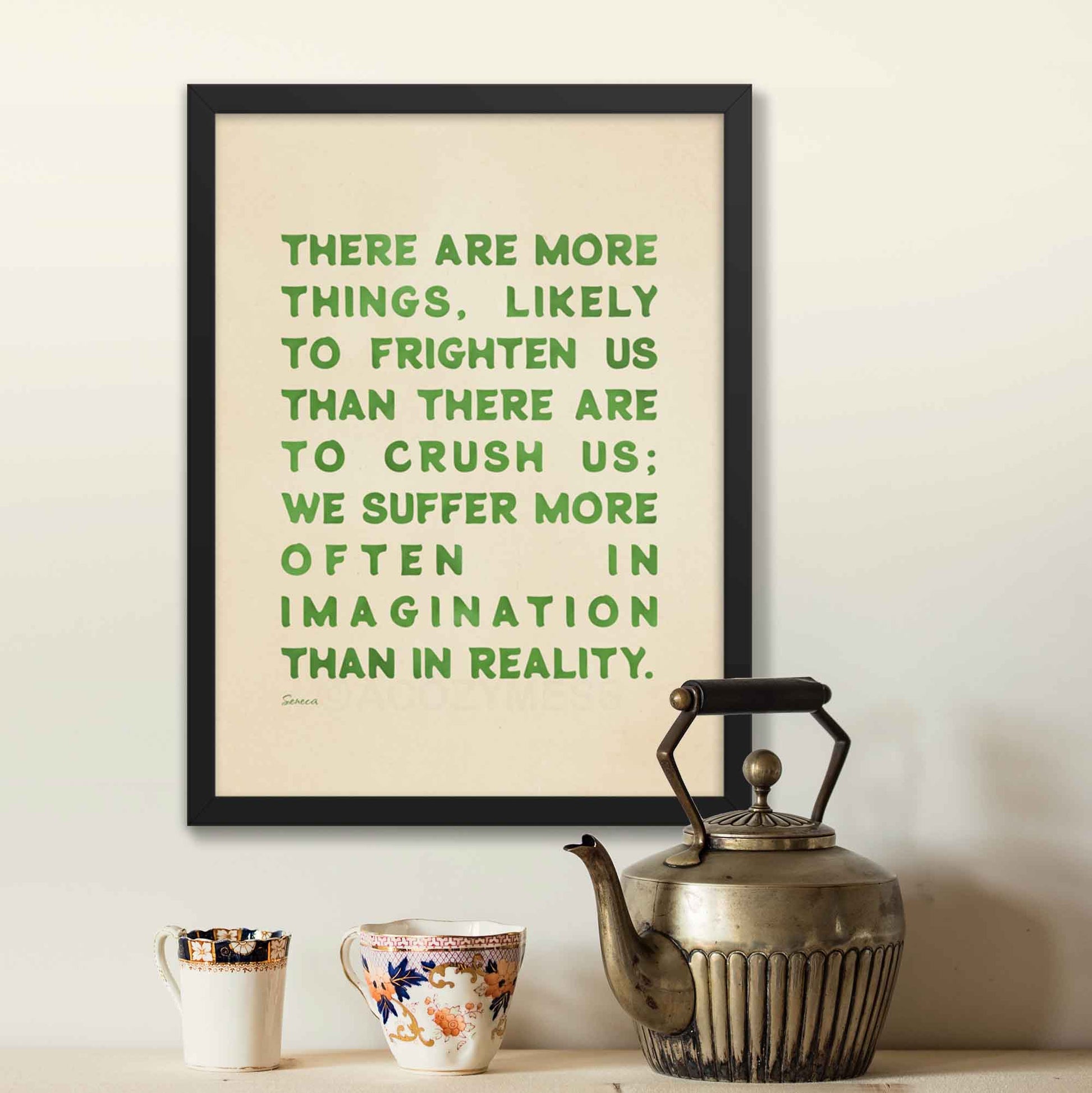 Seneca print with quote on fear, green on beige, displayed in black frame