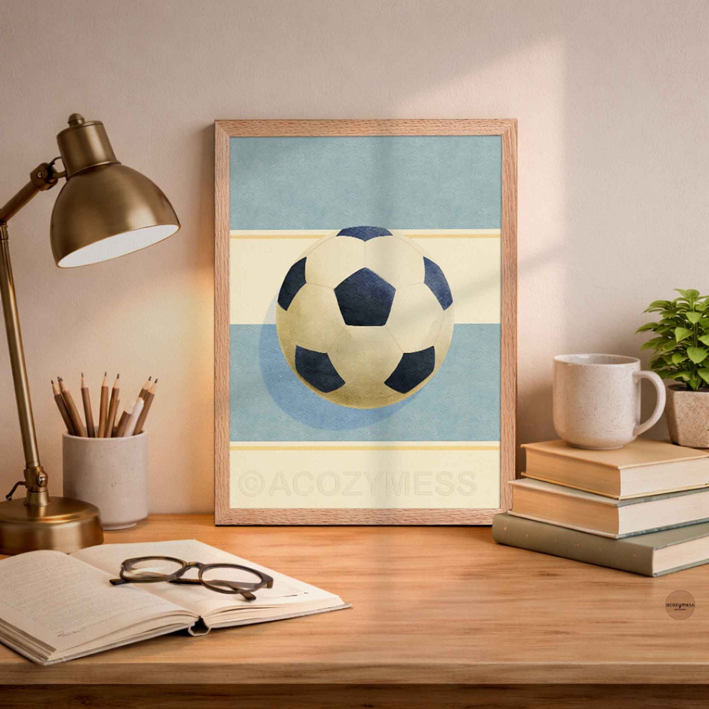 Oakwood-framed soccer ball wall art with a light blue and beige minimalist background for modern home decor.