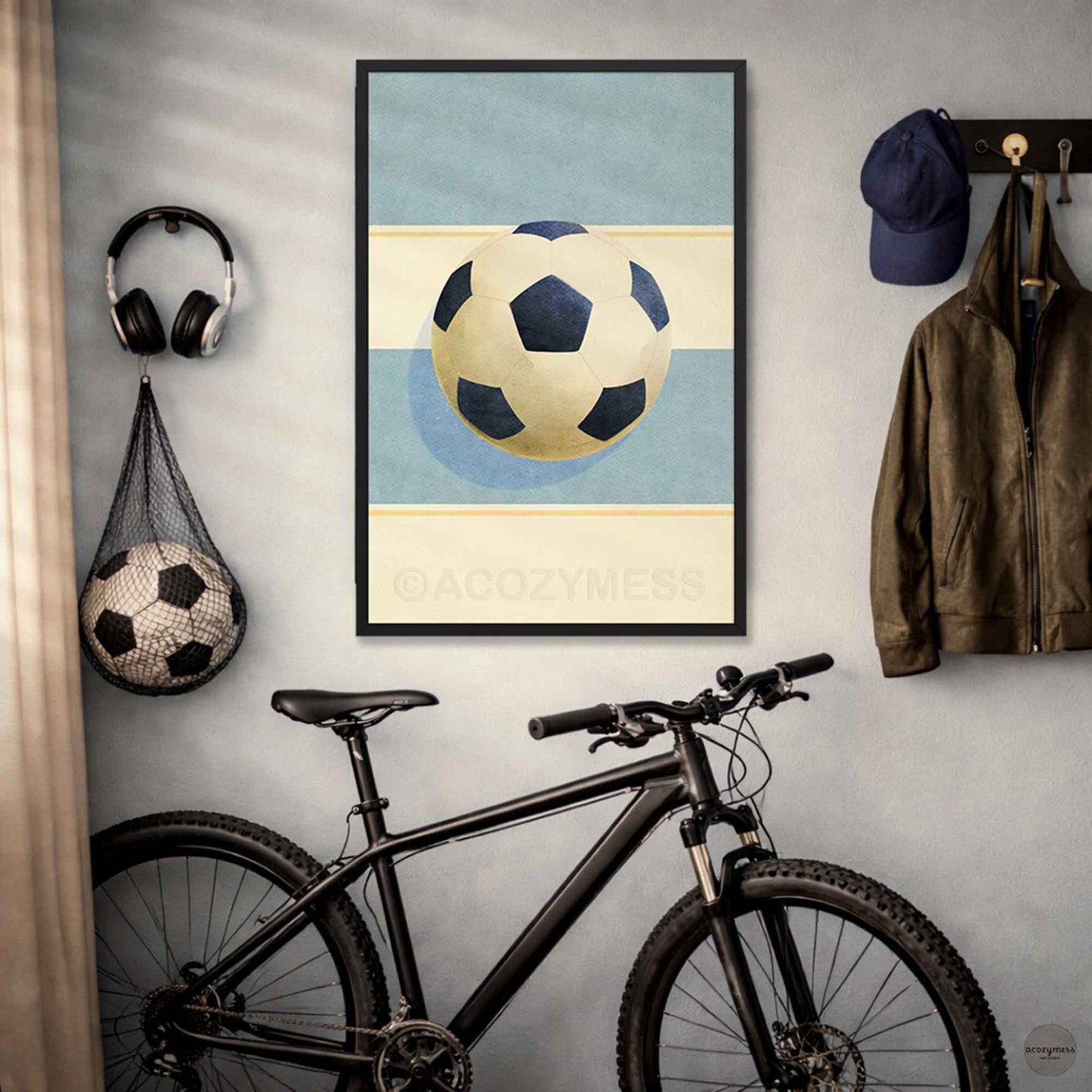 Contemporary soccer wall art in black frame—soccer ball illustration on a light blue and beige background.
