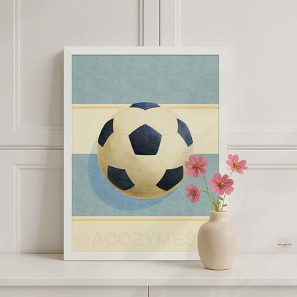 White-framed soccer ball wall art featuring a minimalist light blue and beige background in a modern interior style.