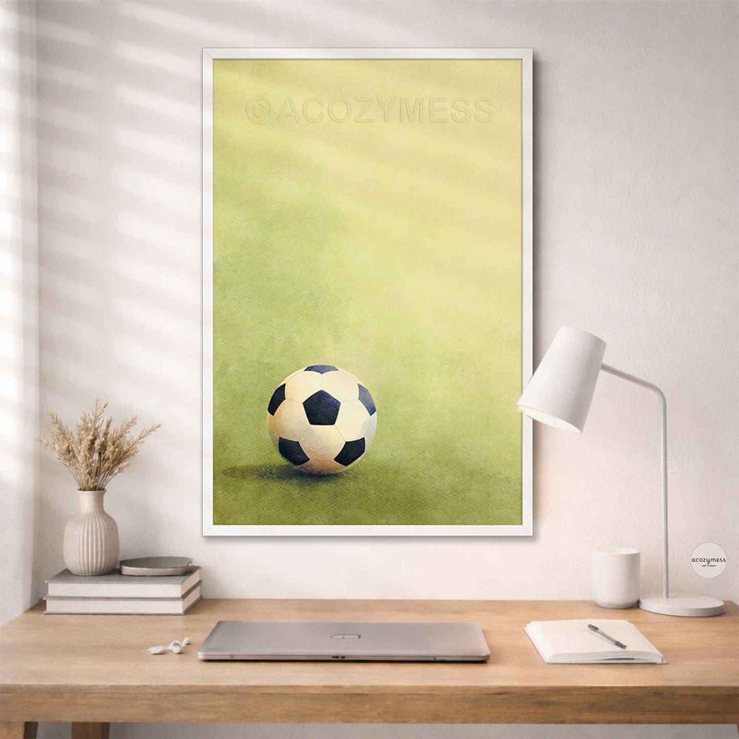 White-framed soccer ball wall art featuring a soccer ball on green grass, clean sports poster style.