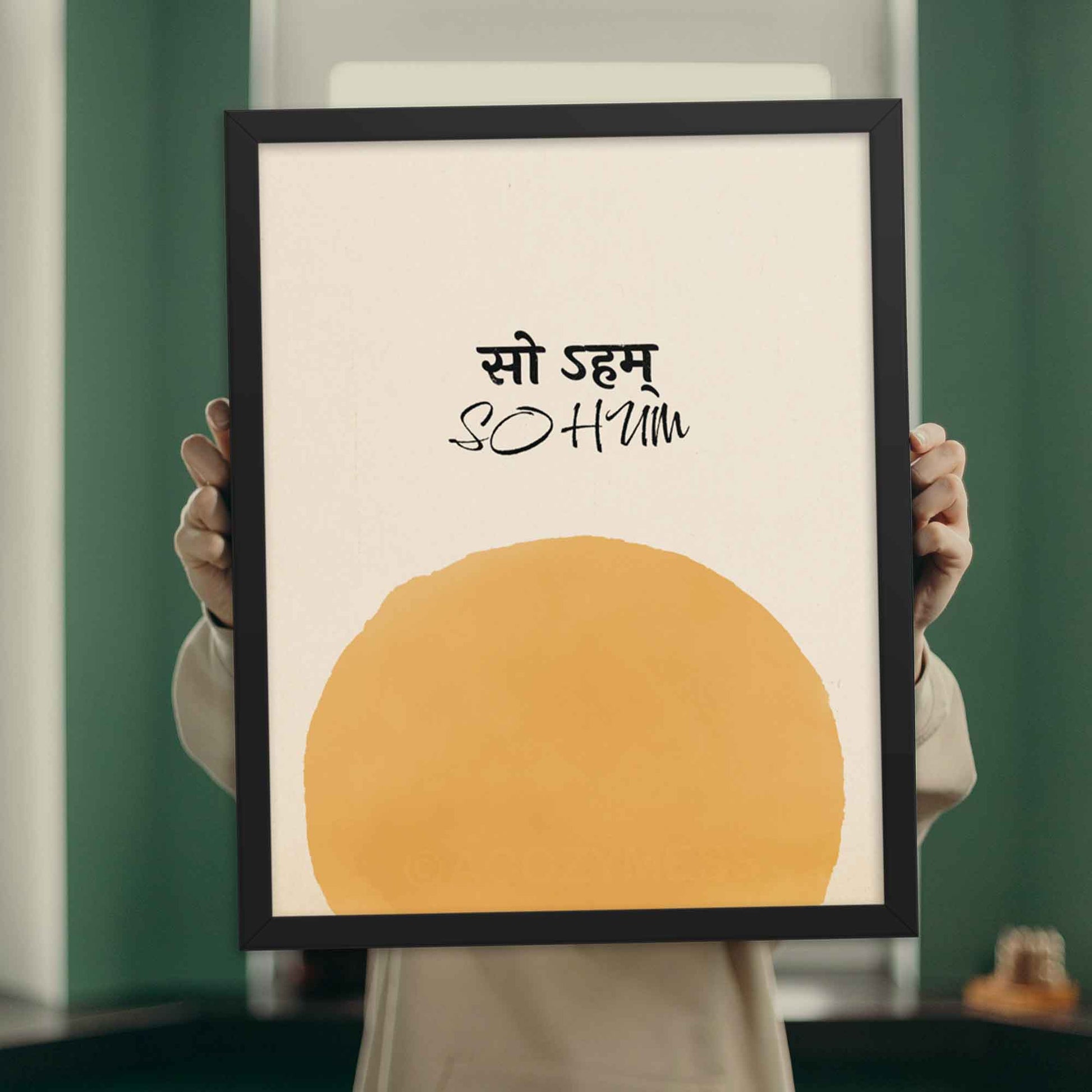 so hum poster with sun art on beige background, displayed in black frame.