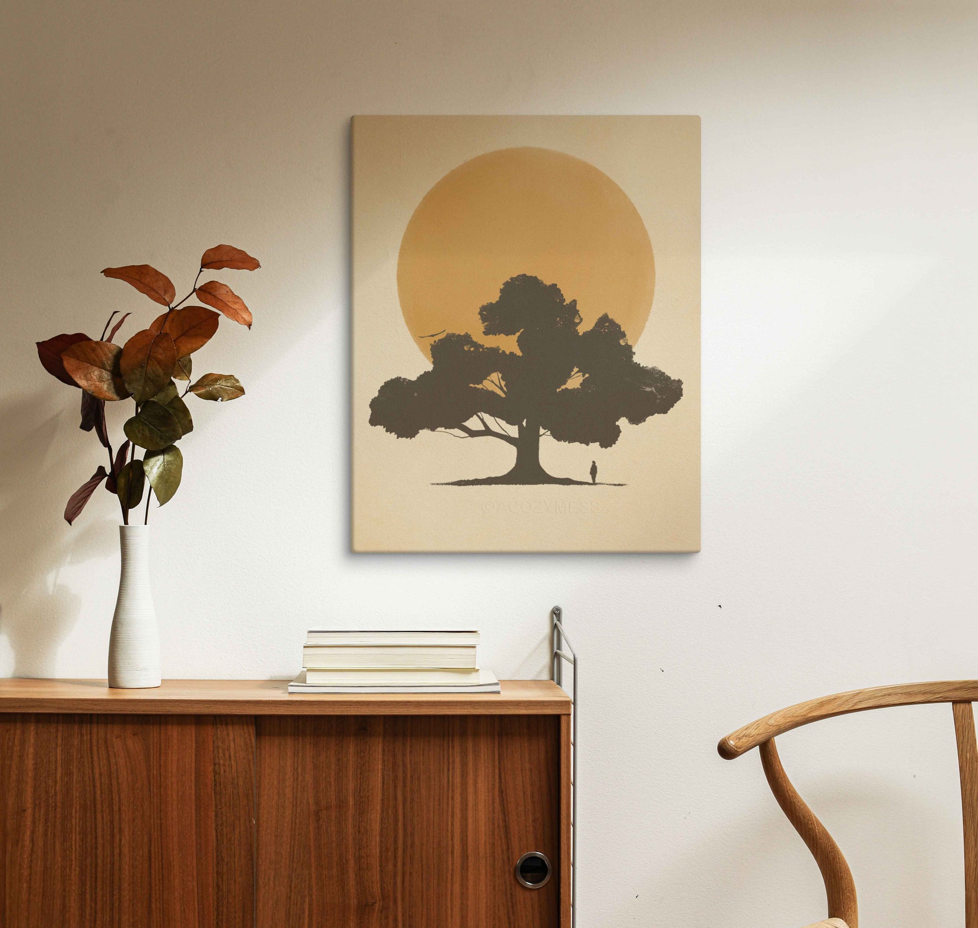 silhouette of a tree and a person in front of sun in yellow color canvas artprint.