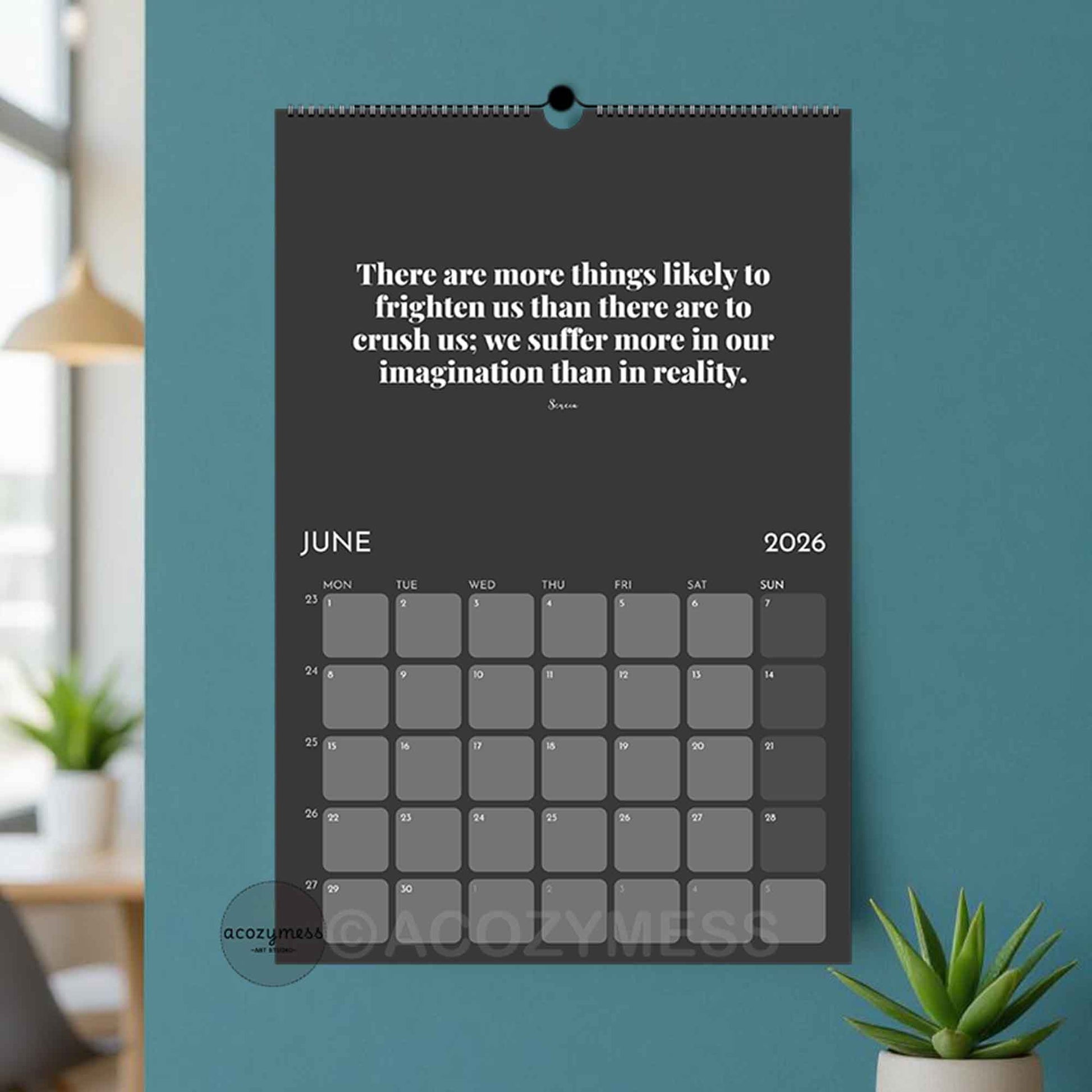 Calendar with a motivational quote on a blue wall