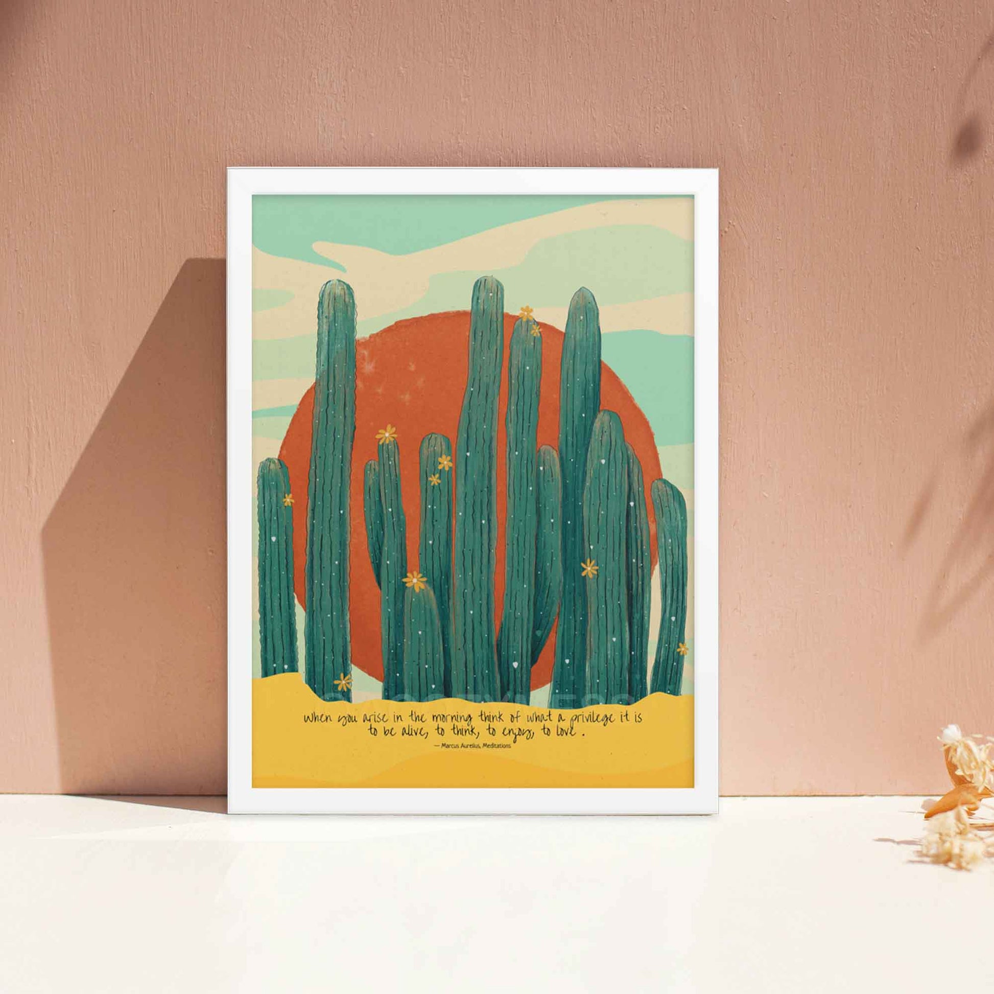 Marcus Aurelius Print with quote, when you arise in the morning with colorful and beautiful sun desert illustration, displayed in white frame.