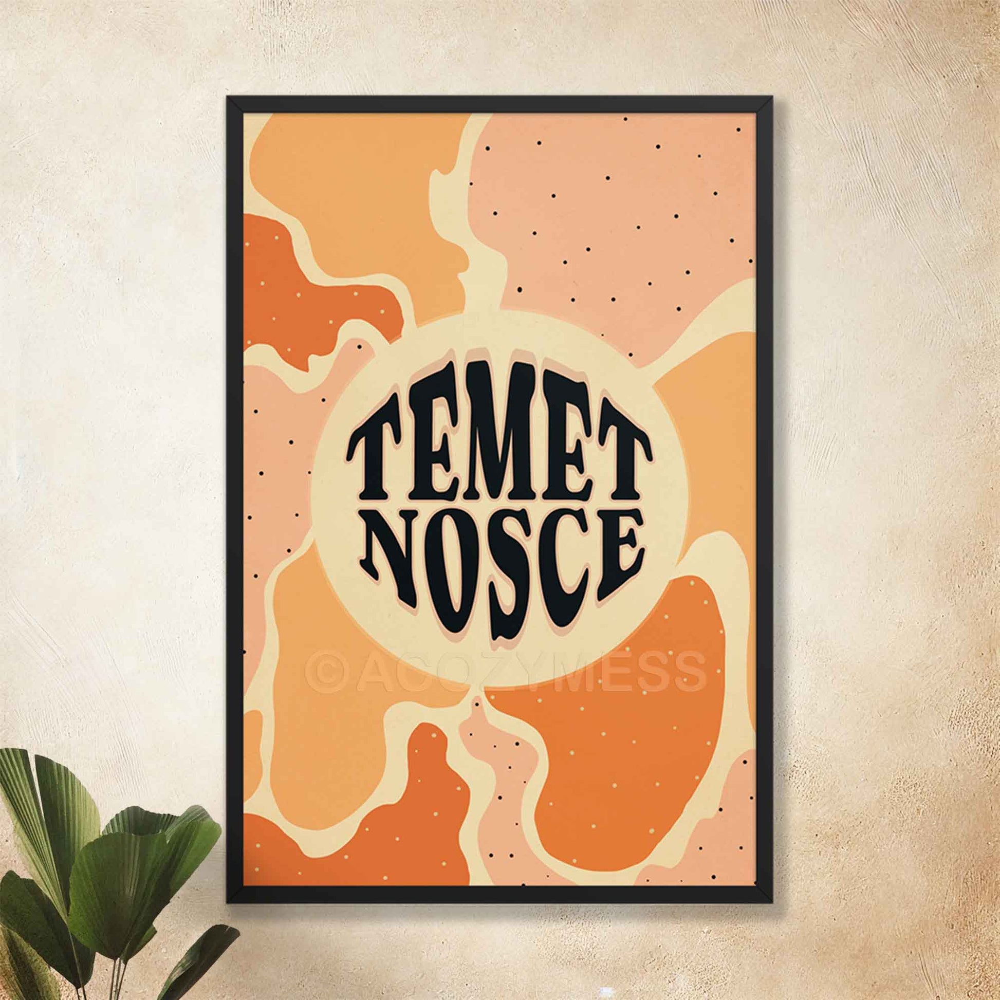 Temet nosce typography poster with abstract artwork in beige, yellow, orange and pink  displayed in black frame. 