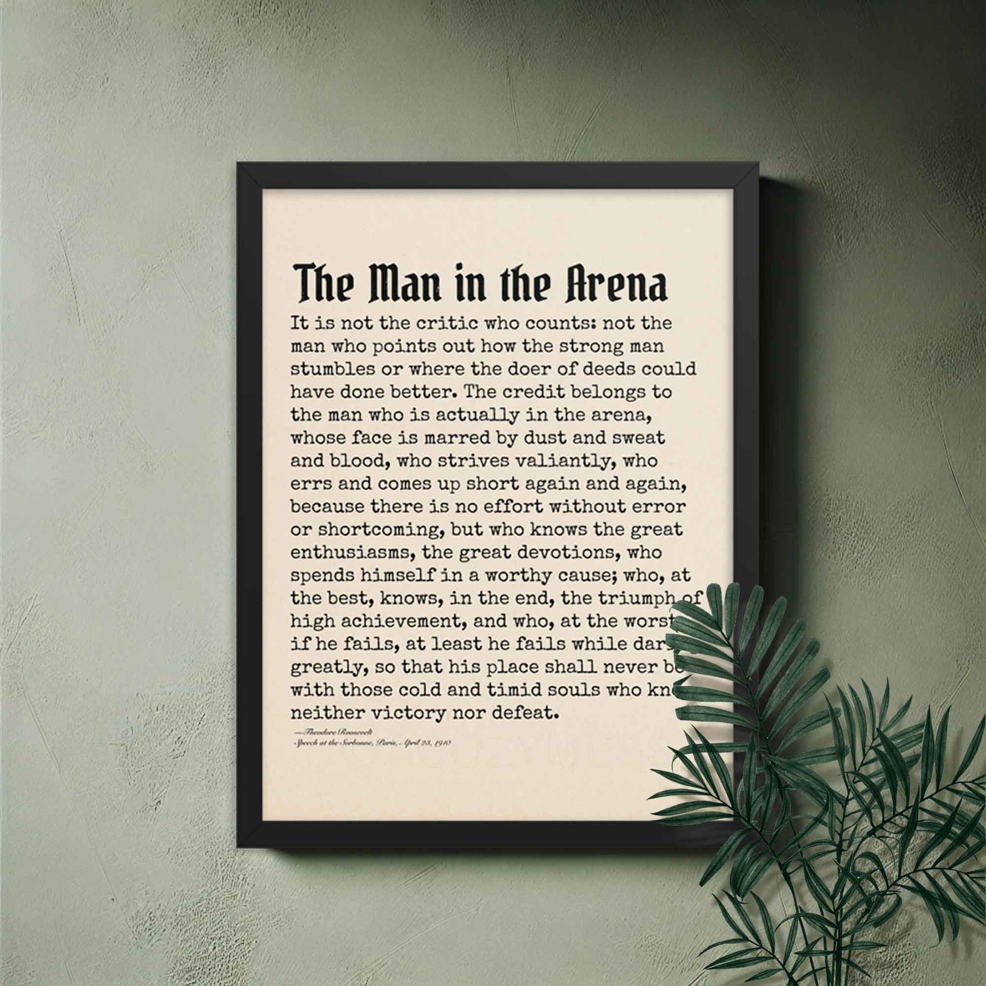 Man in the Arena poster featuring Theodore Roosevelt's iconic quote in black frame as inspirational office wall decor