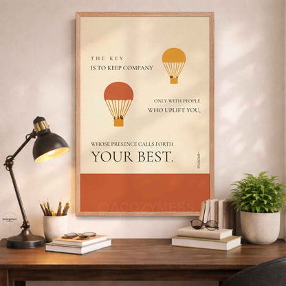 Epictetus quote wall art in oakwood frame with beige background and hot air balloons above a desk