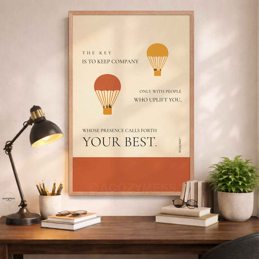 Epictetus quote wall art in oakwood frame with beige background and hot air balloons above a desk