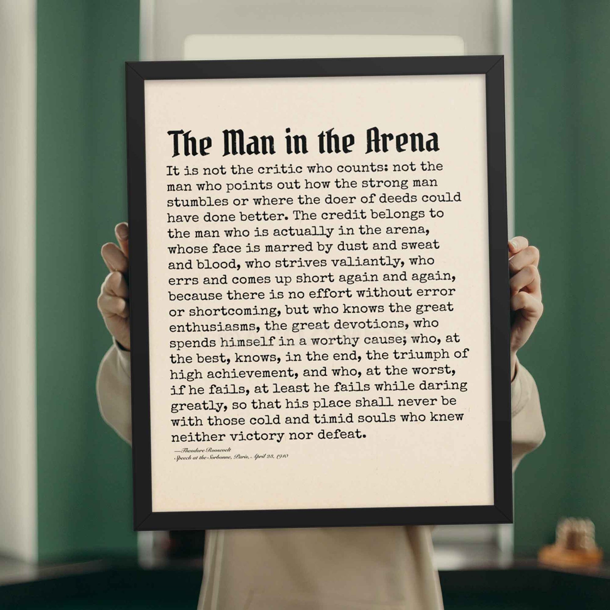 The Man in the Arena poster featuring Theodore Roosevelt's iconic quote in black frame perfect as motivational gift.