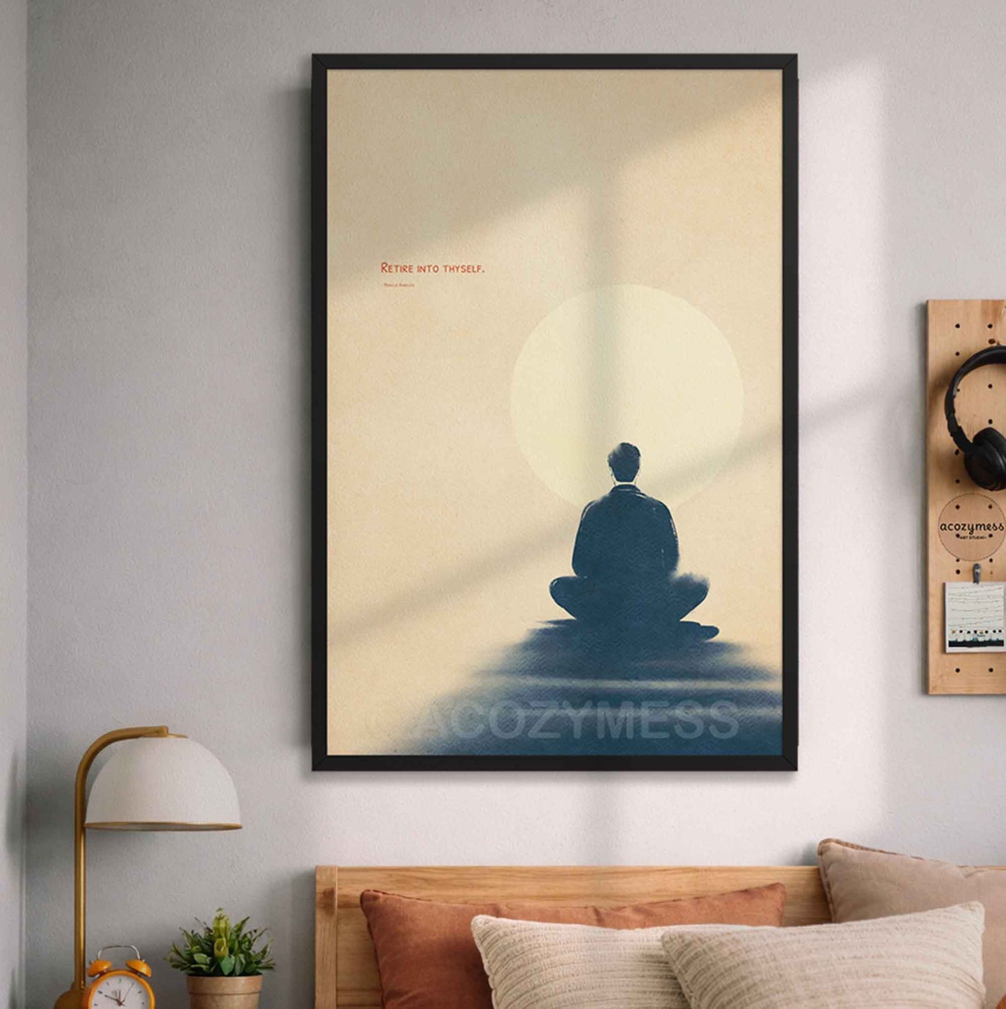 The design depicts a sleek silhouette of a person meditating under the clean typography quote "Retire into thyself" by Marcus Aurelius, hanging above a bed.