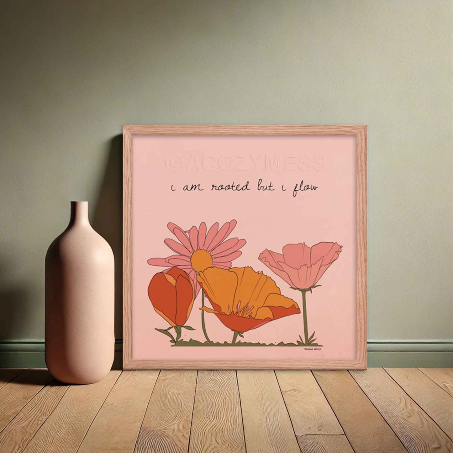 "Art print featuring Virginia Woolf's quote 'I am rooted, but I flow,' with a vibrant floral illustration in pink, orange, and yellow hues," in oakwood square frame.