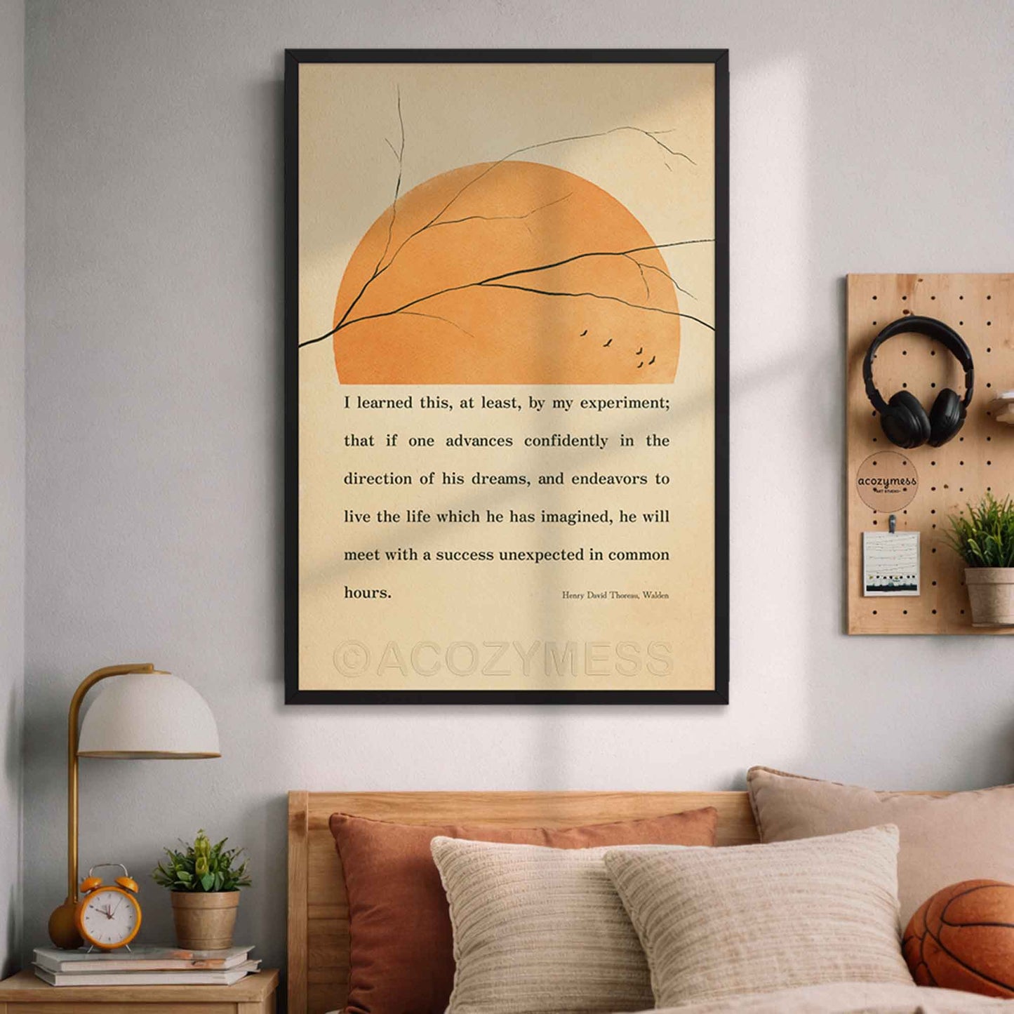 Inspirational wall art framed in black featuring Thoreau quote and minimalist nature design