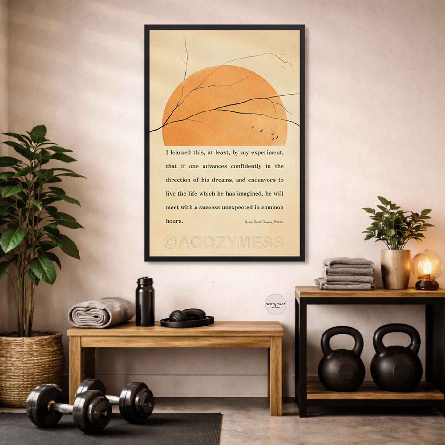 Thoreau quote Motivational  poster in black frame  on a wall above a wooden bench with fitness equipment in a home setting.