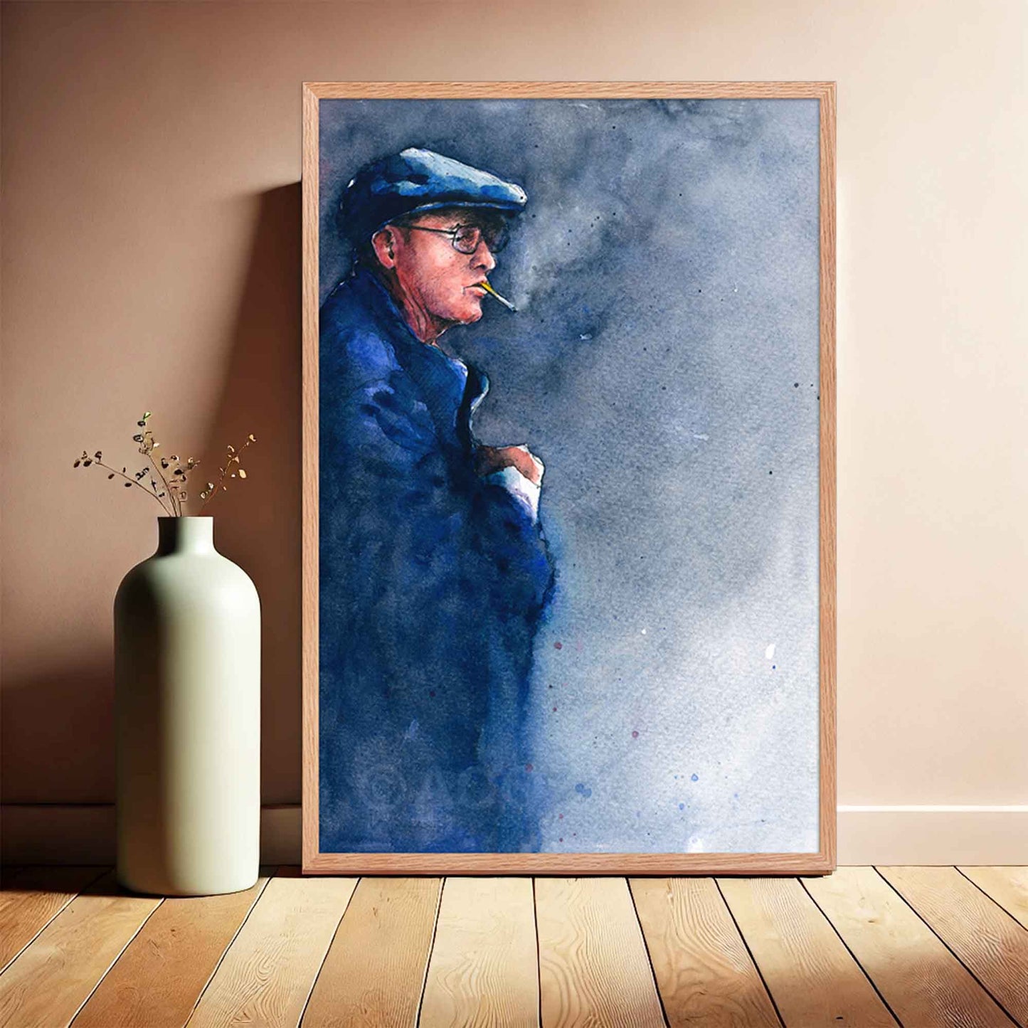 watercolor painting of a man in blue, framed in oakwood.