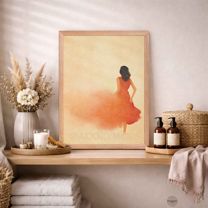 Oakwood Framed artwork of a woman in an orange dress on a wooden shelf 