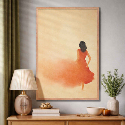 Framed artwork of a woman in an orange dress on a wall above a wooden side table with decor items.