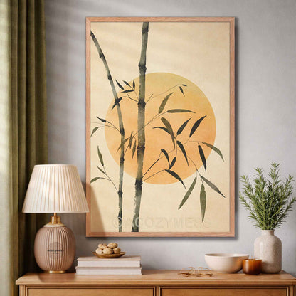 Framed artwork of bamboo and a sun on a wall above a wooden console table with decor items.