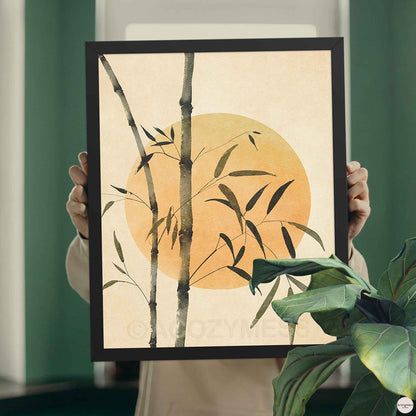 Black Framed artwork with bamboo and a sun artwork.
