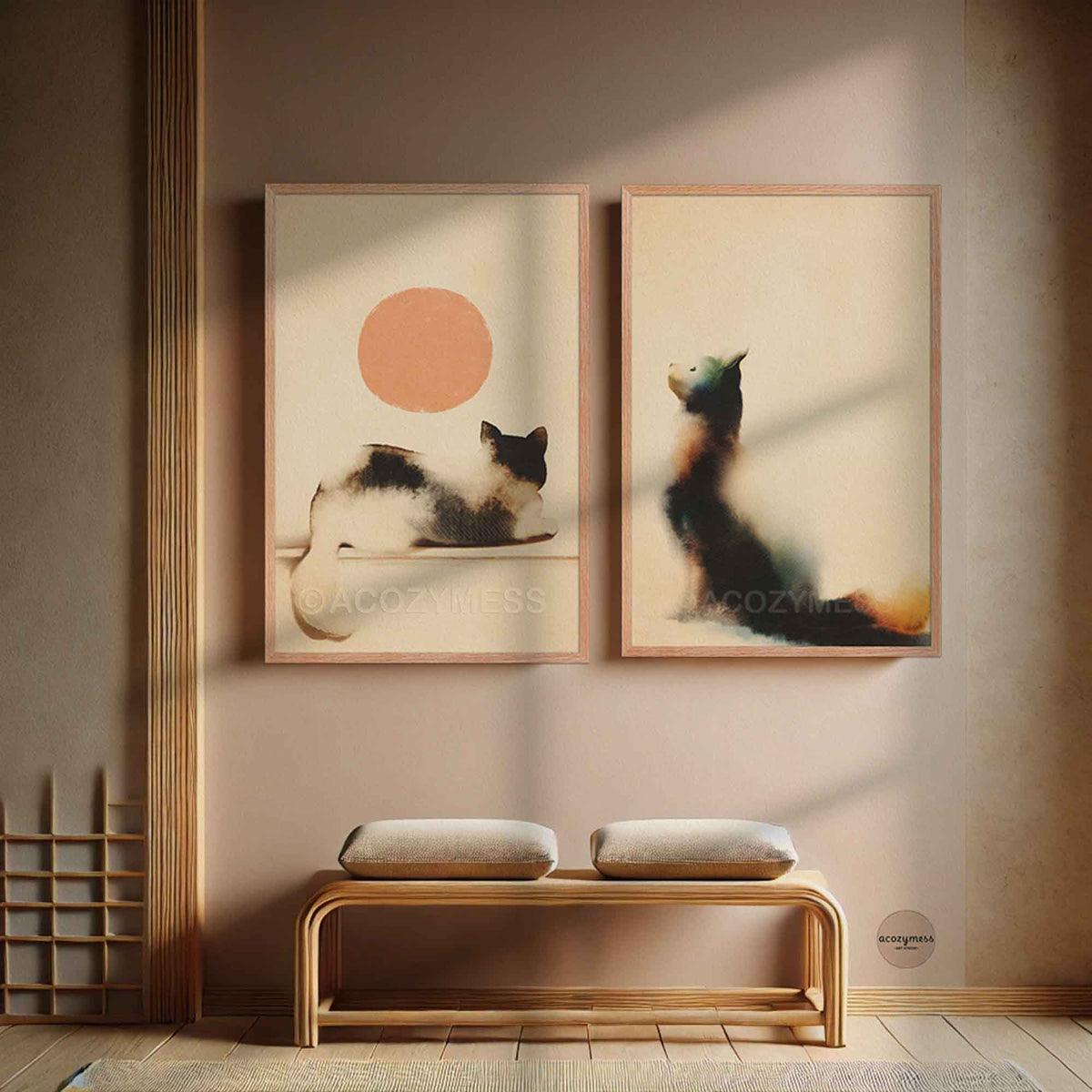 Oak framed cat and peach sun poster hung beside a sitting cat print above a wooden bench