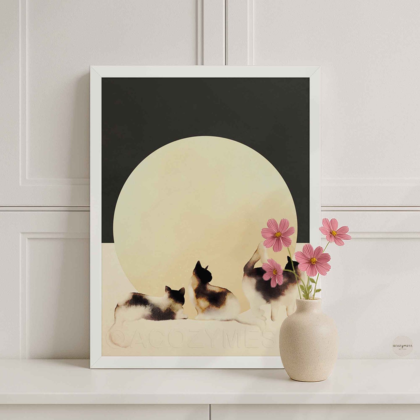 Minimalist three cats print in a white frame, charcoal-gray and beige neutral palette with large circular sun backdrop.