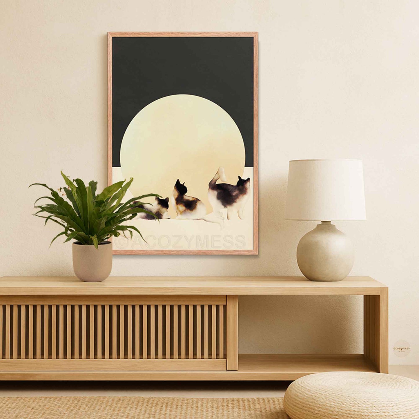 Oakwood Framed artwork of cats on a wall above a wooden console table 