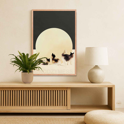 Oakwood Framed artwork of cats on a wall above a wooden console table 