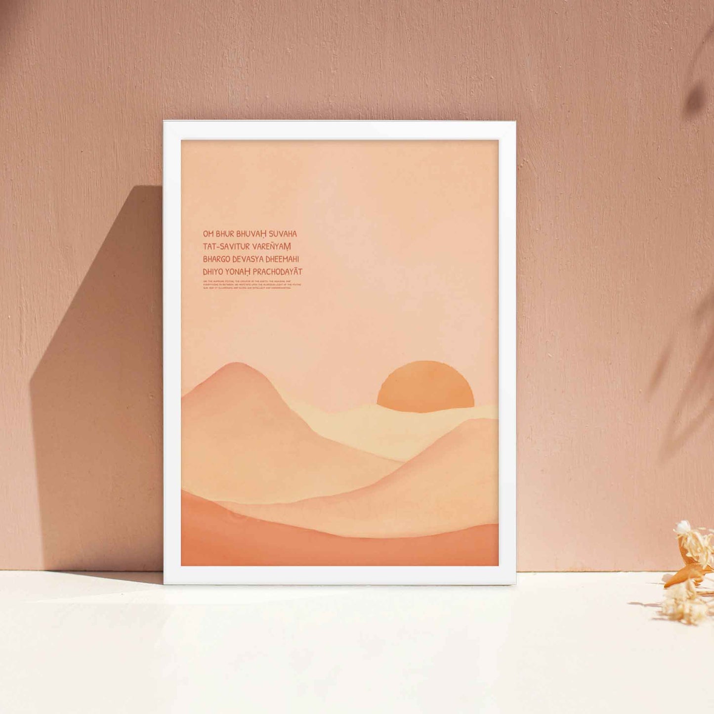 Gayatri Mantra poster featuring calming landscape art in a light color palette, displayed in a white frame, perfect for meditation or yoga room decor.