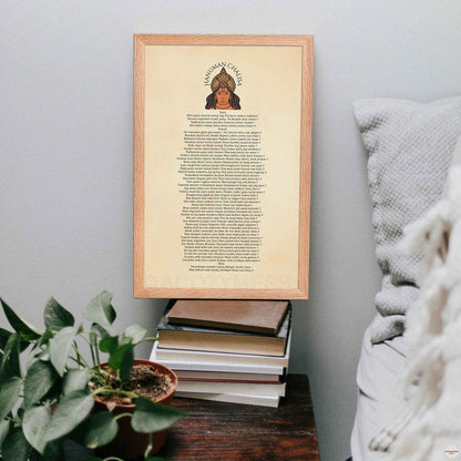 Hanuman Chalisa poster in Oakwood frame on a bedside table