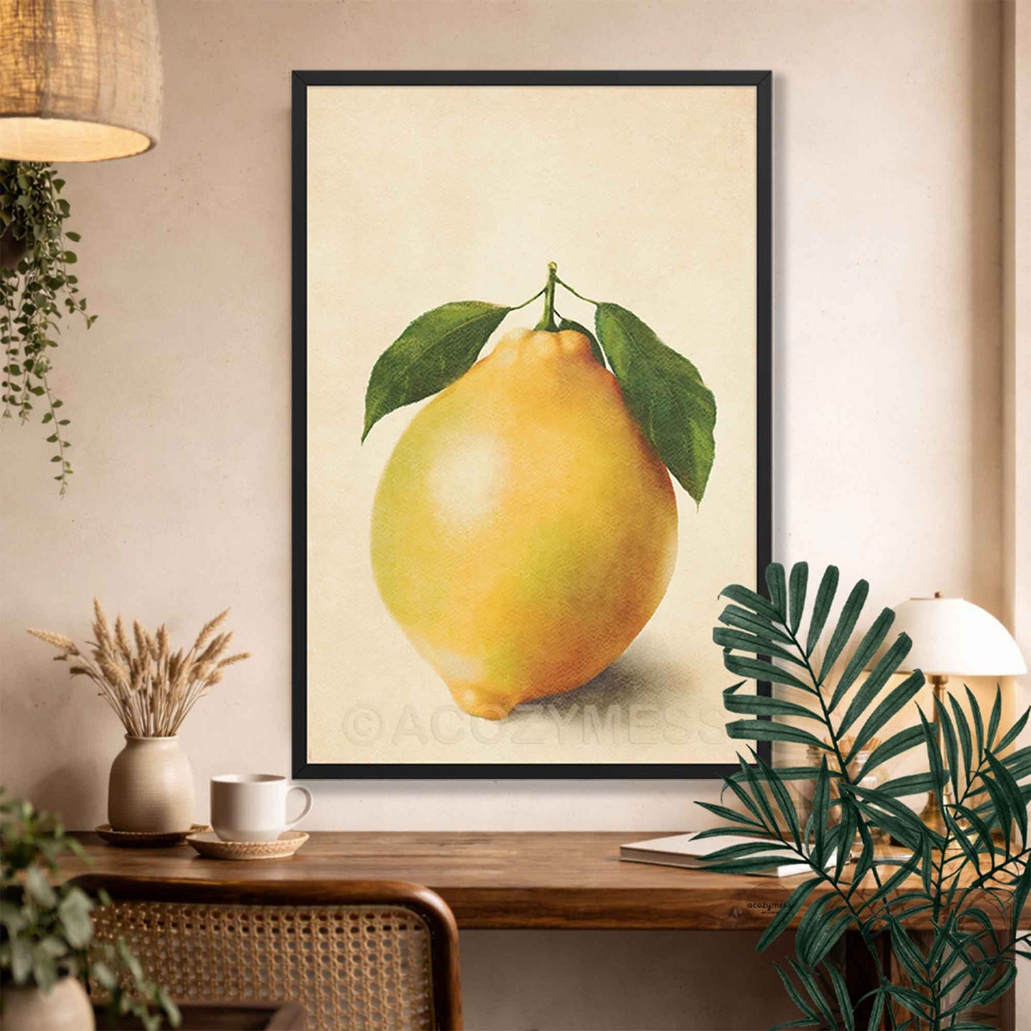 Black Framed artwork of a lemon on a wall above a wooden console table with decor items.