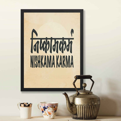 A black-framed typography poster featuring the concept of Nishkama Karma (निष्काम कर्म) in both Hindi and English on an aged, old-paper background for meaningful and thoughtful decor.