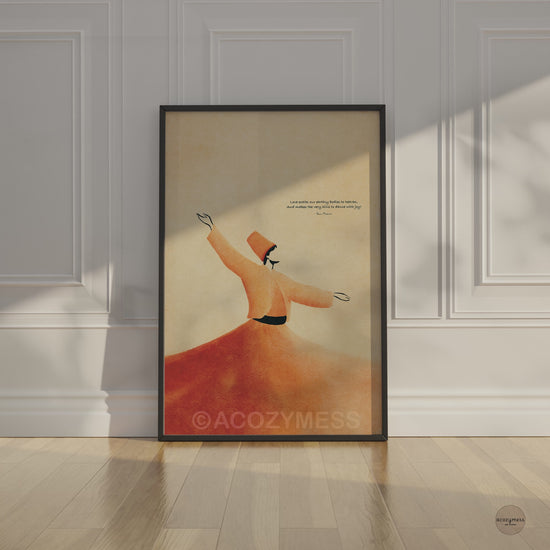 Video of a black framed Rumi whirling dervish quote art poster leaning against a white paneled wall in soft sunlight
