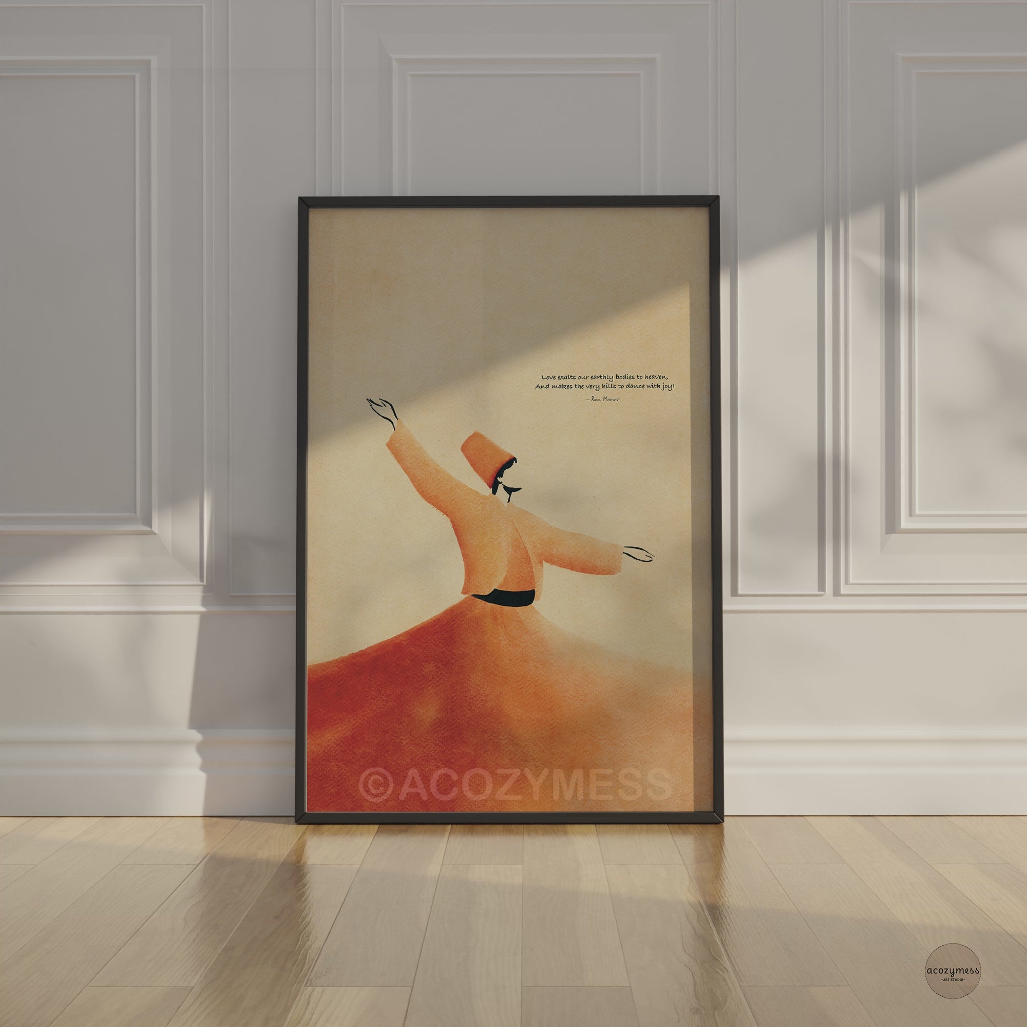 Video of a black framed Rumi whirling dervish quote art poster leaning against a white paneled wall in soft sunlight