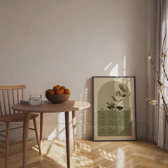 One page calendar 2026 with nature inspired art in green and beige displayed in black frame