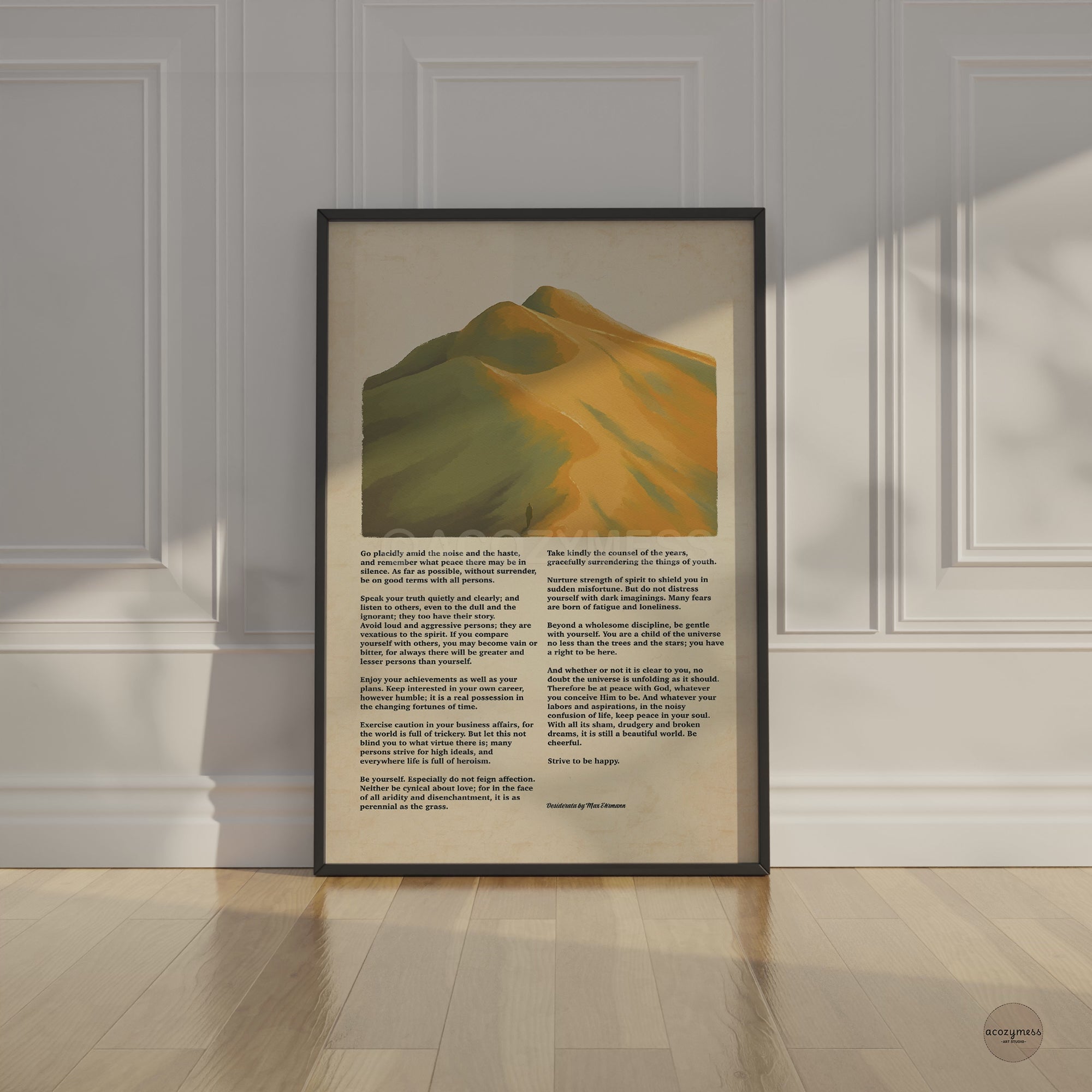 Black framed artwork with mountain illustration and Desiderata poem  
