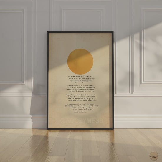 Invictus poem with sun art displayed in black frame