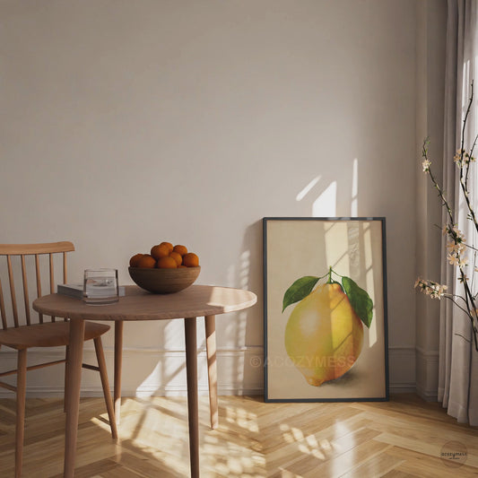 Contemporary fruit wall art in black frame—minimal lemon still life on beige neutral background for dining decor.