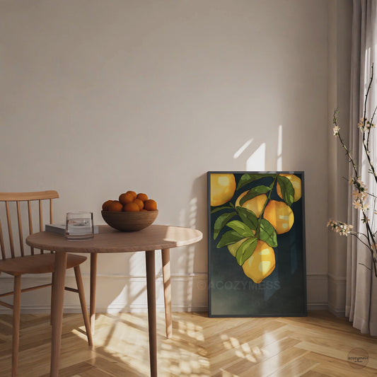 Black framed lemon wall art poster featuring bright lemons illustrated against a dark background displayed in dining room.