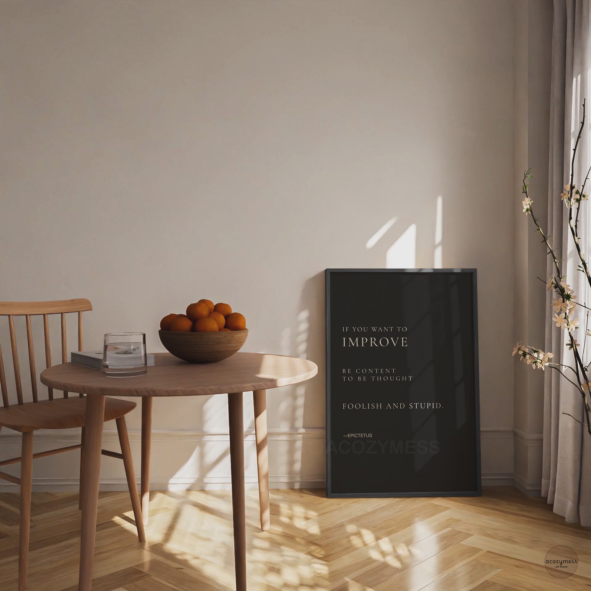 Epictetus quote poster in black frame.