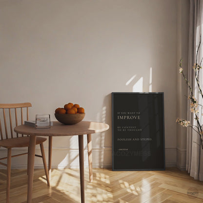 Epictetus quote poster in black frame.