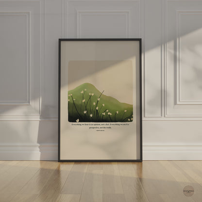 A Marcus Aurelius print in black frame featuring Marcus Aurelius' quote, Everything we hear is an opinion, not a fact. Everything we see is a perspective, not the truth, along with a serene nature illustration of a green mountain and delicate white flowers. 