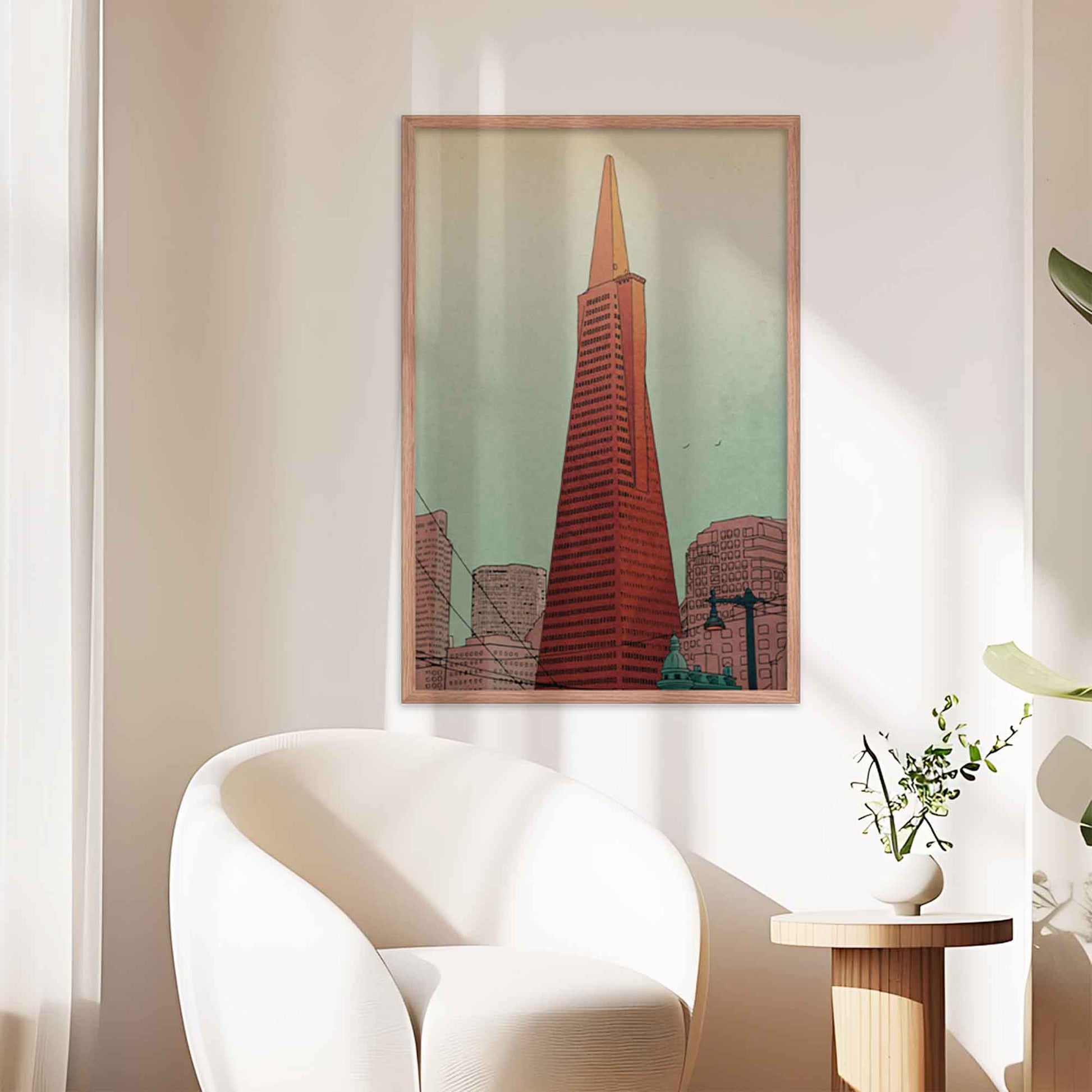 San Francisco Illustrated poster featuring Transamerica Pyramid displayed in oakwood frame on a office wall.