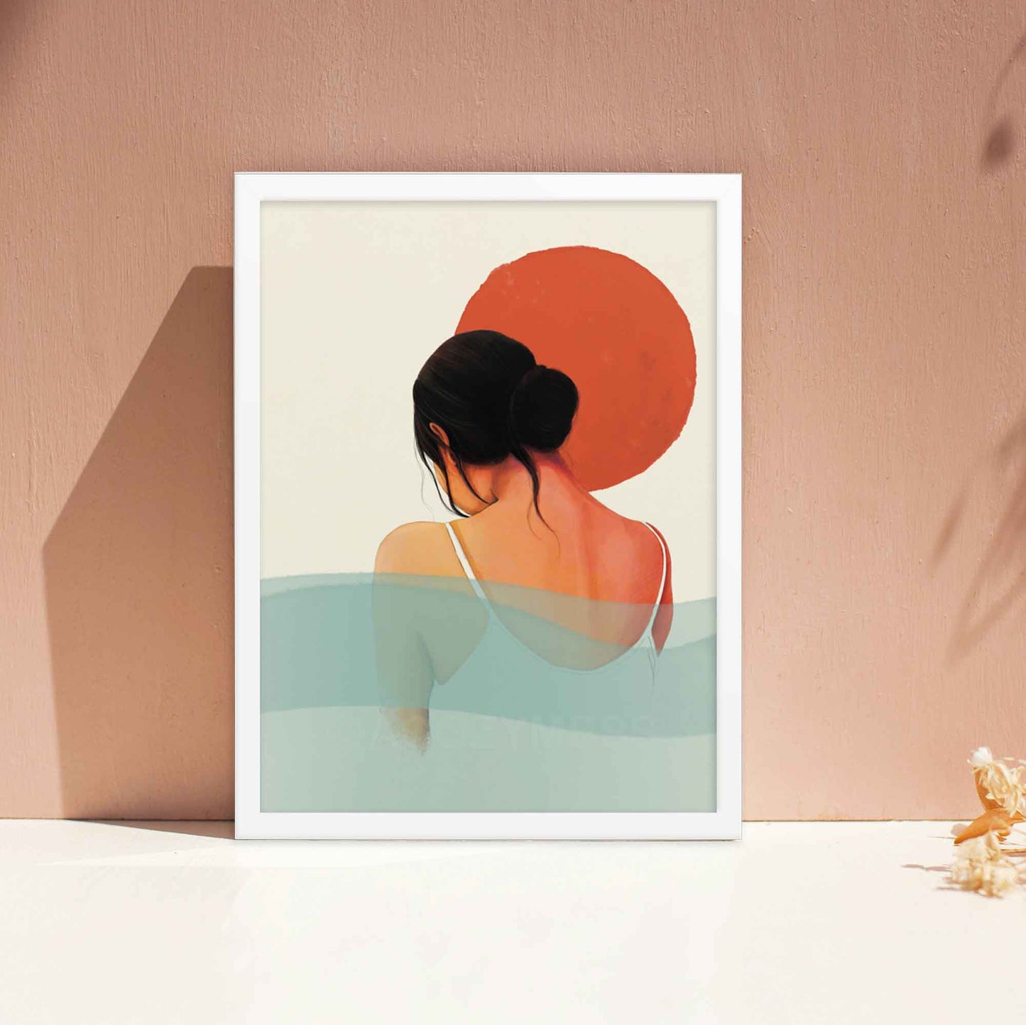 Calming wall art of sun and water featuring a woman in orange, white, pink and blue colors, displayed in white frame