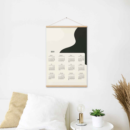 2025 yearly calendar poster with minimalist design, in oak wood hanger, perfect for modern home or office decor.