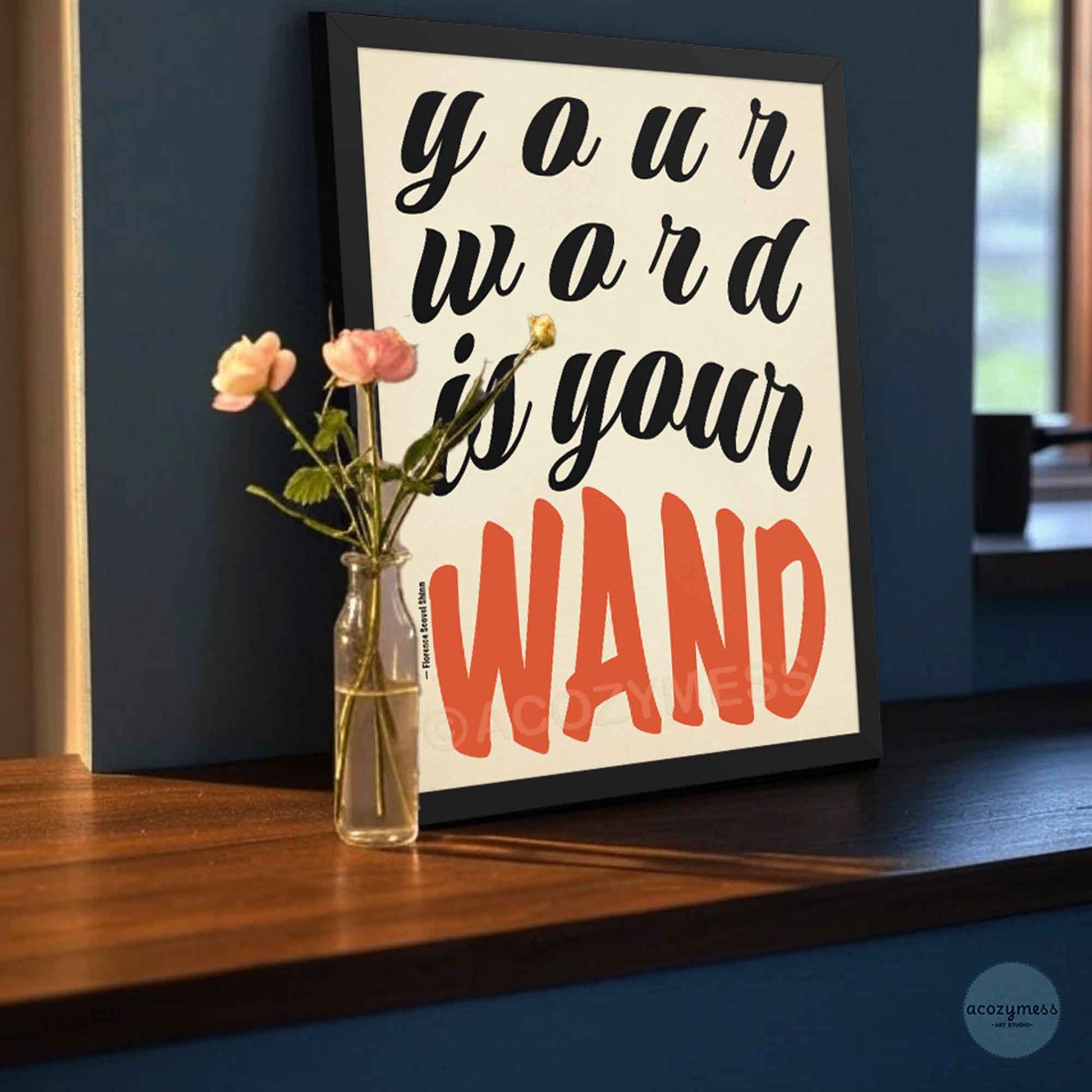 Framed motivational quote 'Your word is your wand'.