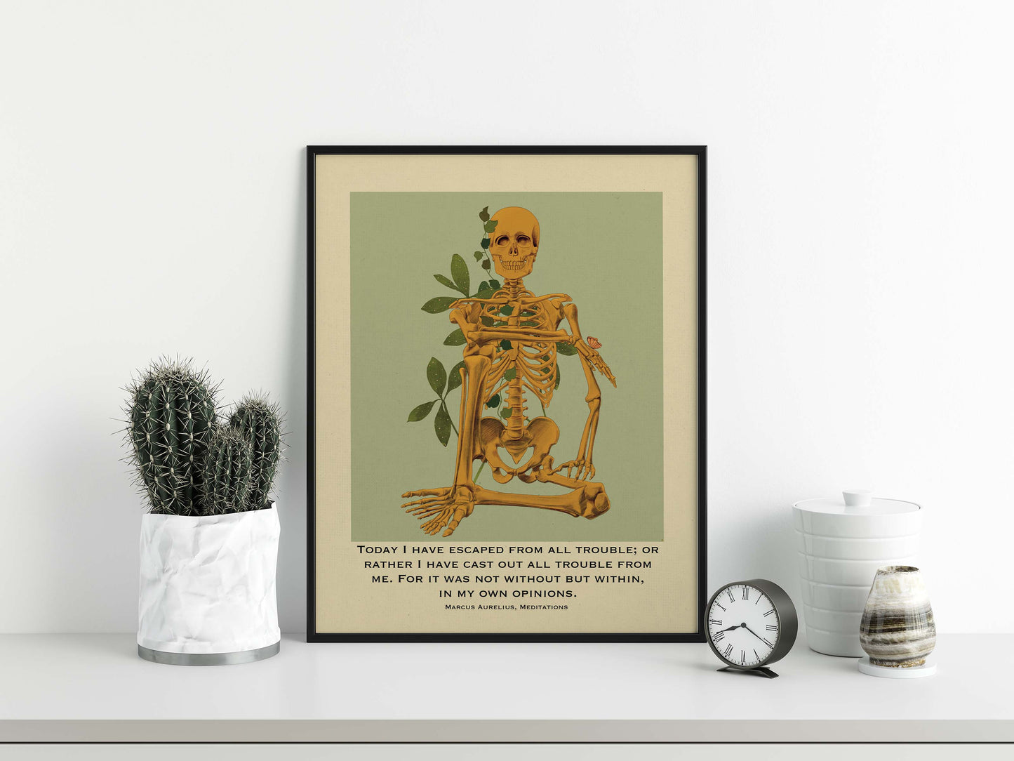 Marcus Aurelius Print and  skeleton sitting in happy pose in yellow color with green & beige background poster displayed in black frame