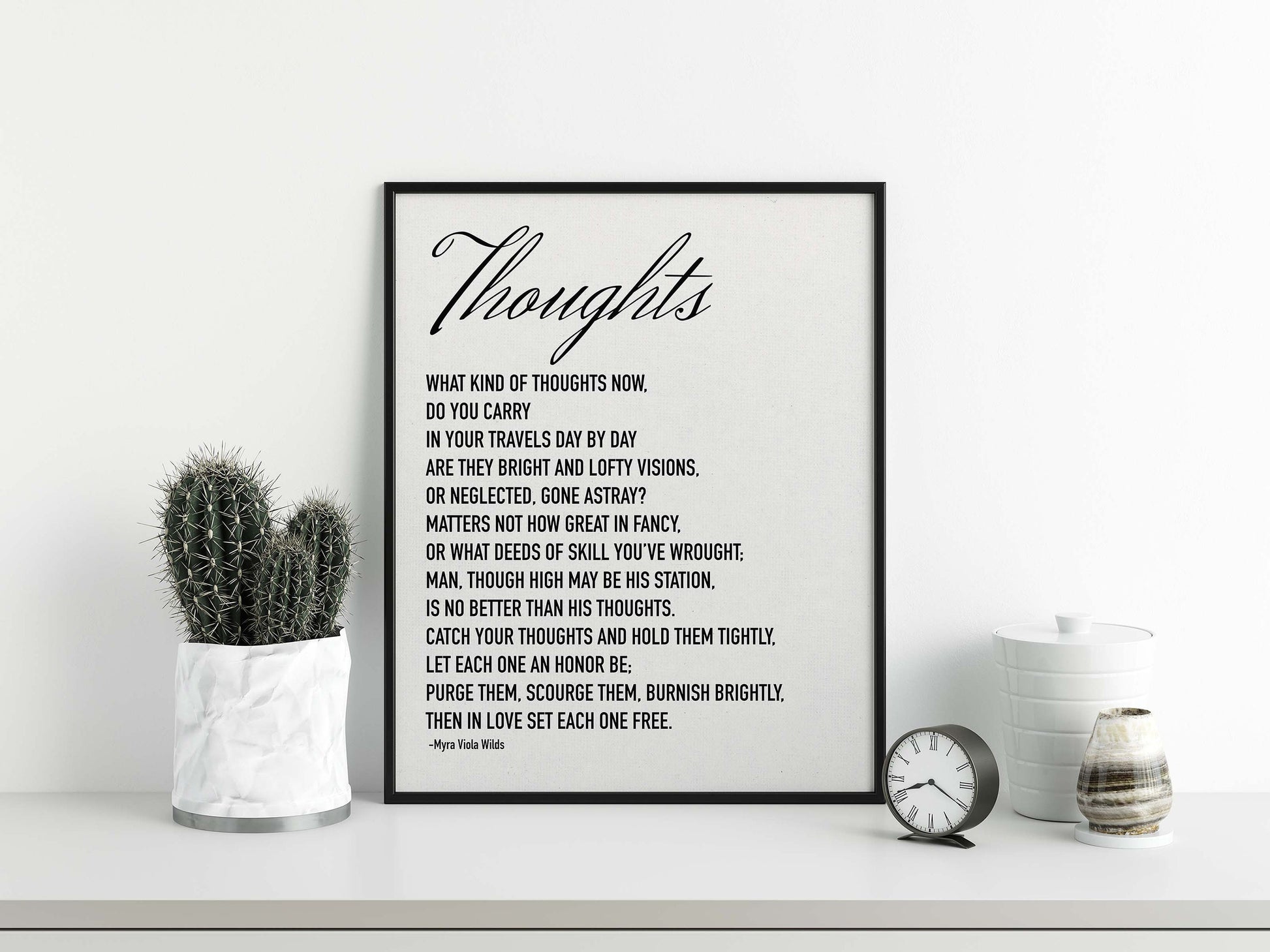 Thoughts poem by Myra Viola Wilds black on white poster in black frame mockup