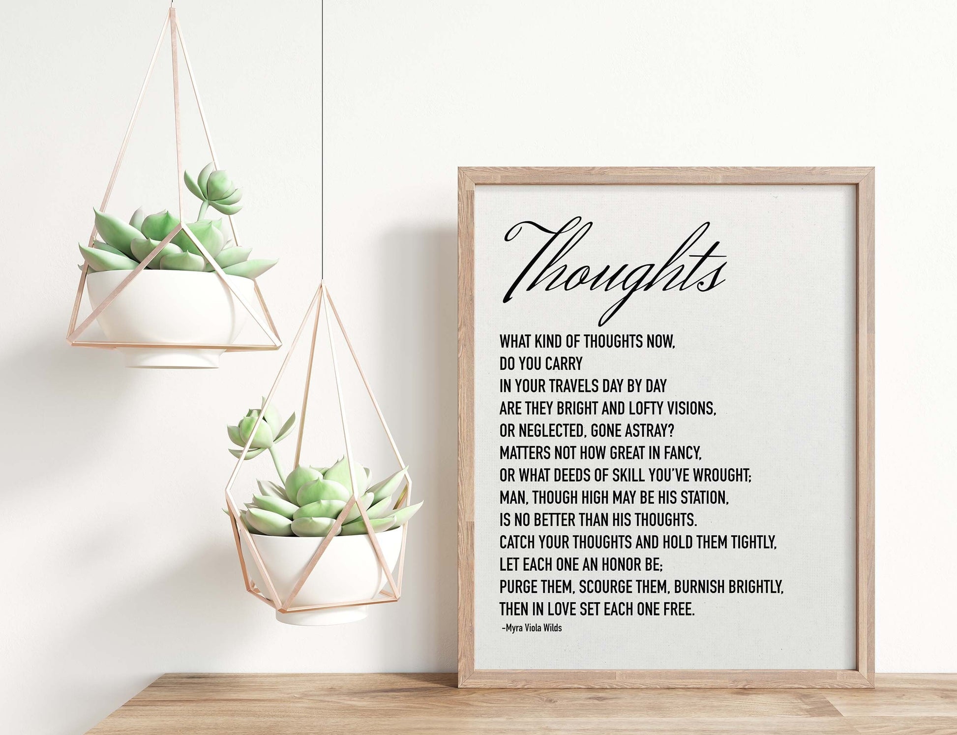 Thoughts poem by Myra Viola Wilds black on white poster in wood frame mockup